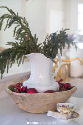french country kitchen with white ironstone pitcher in wood bowl