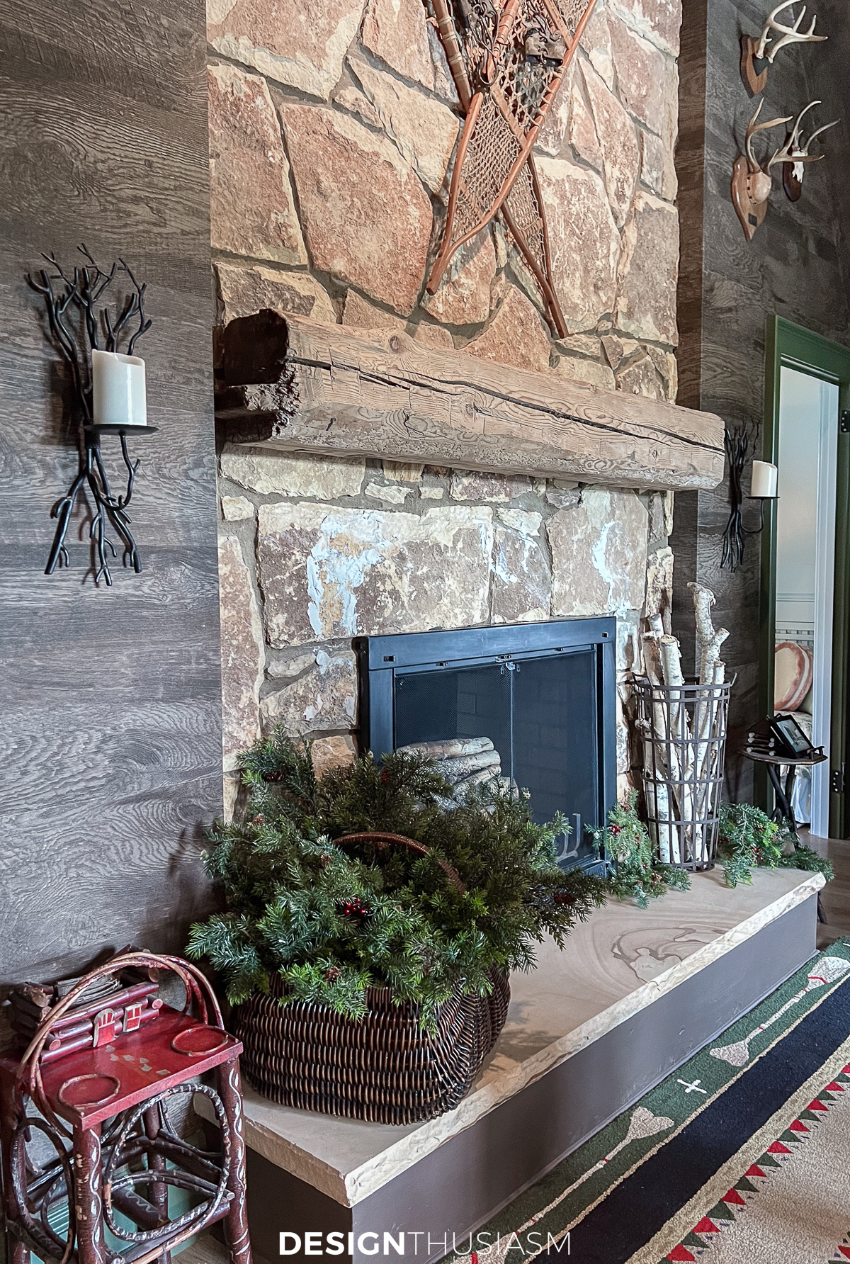 cozy cabin fireplace with rustic christmas decorations