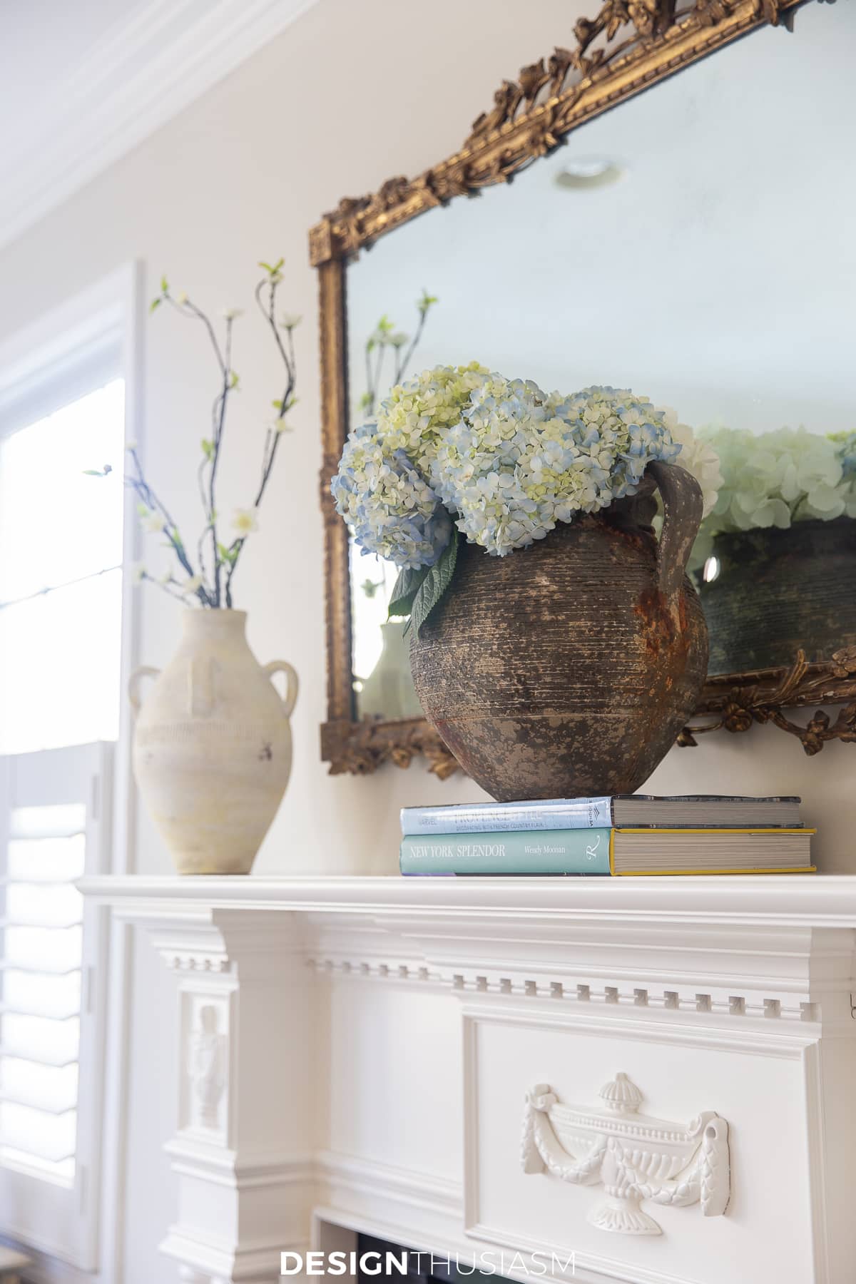 spring mantel pale blue hydrangeas in a rustic vase