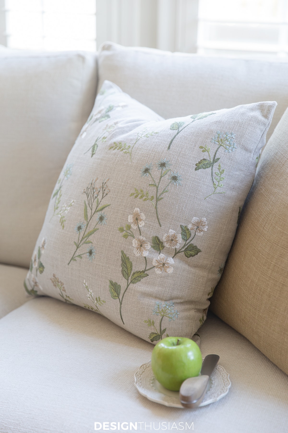 embroidered spring pillow in soft tranquil colors