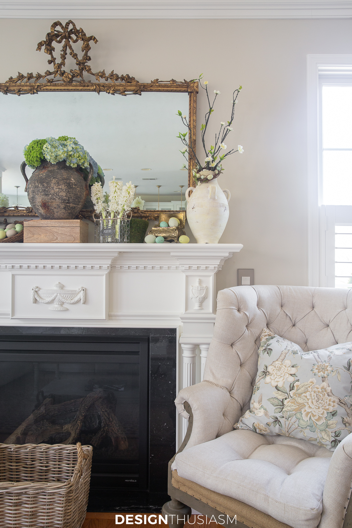 spring mantel with french tufted chair and floral pillow