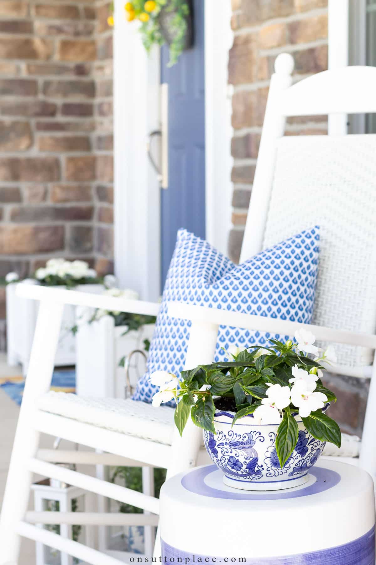 summer porch with rockers pillows and plants