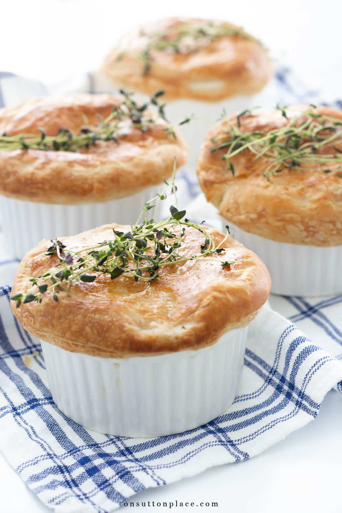 mini chicken pot pies garnished with thyme