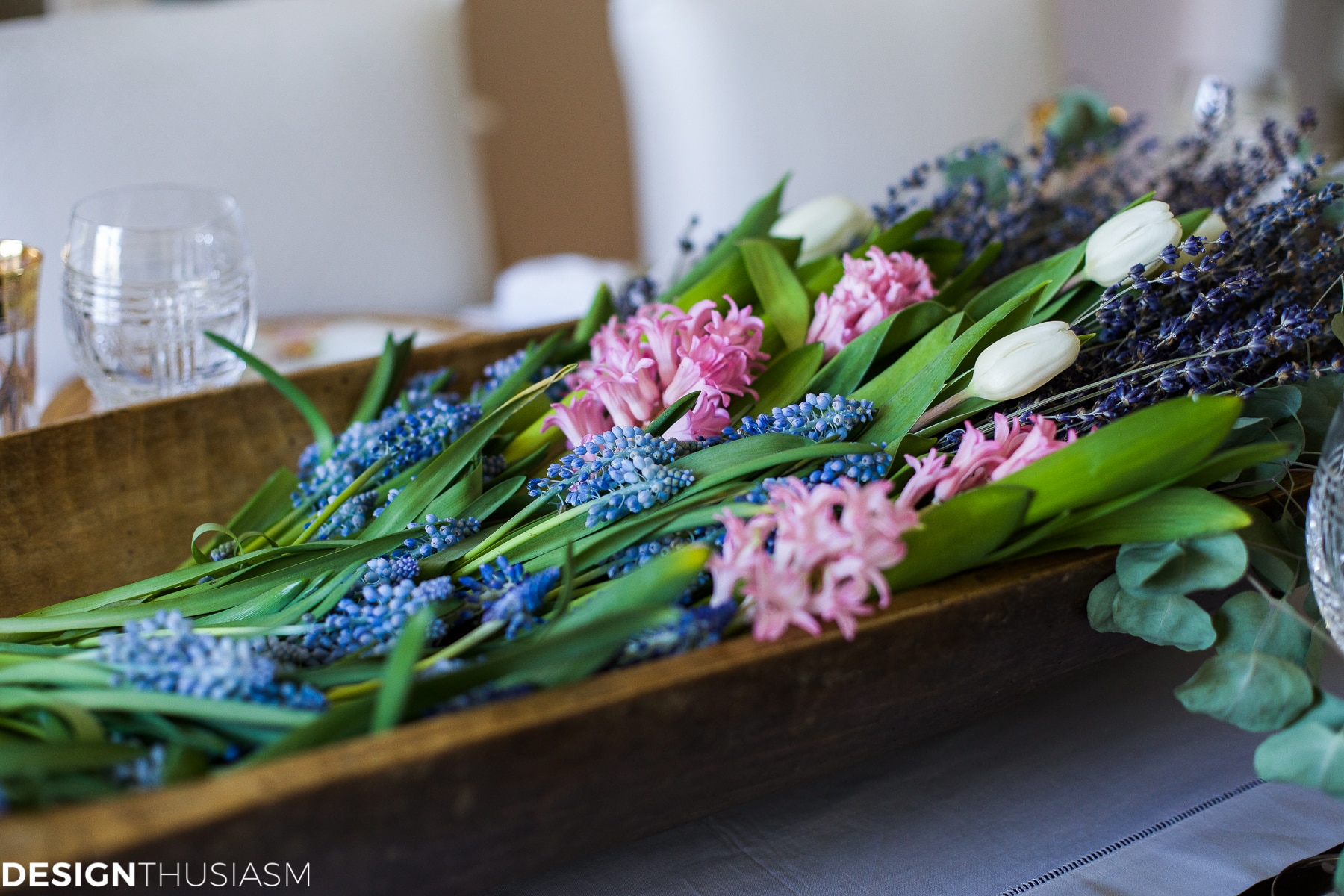 French country style table setting with dough bowl flowers