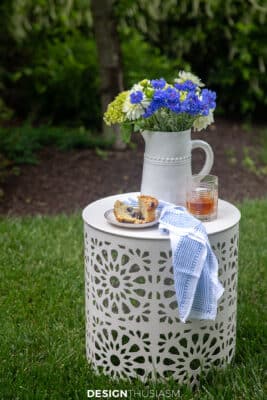 casual summer gathering flowers on drum table