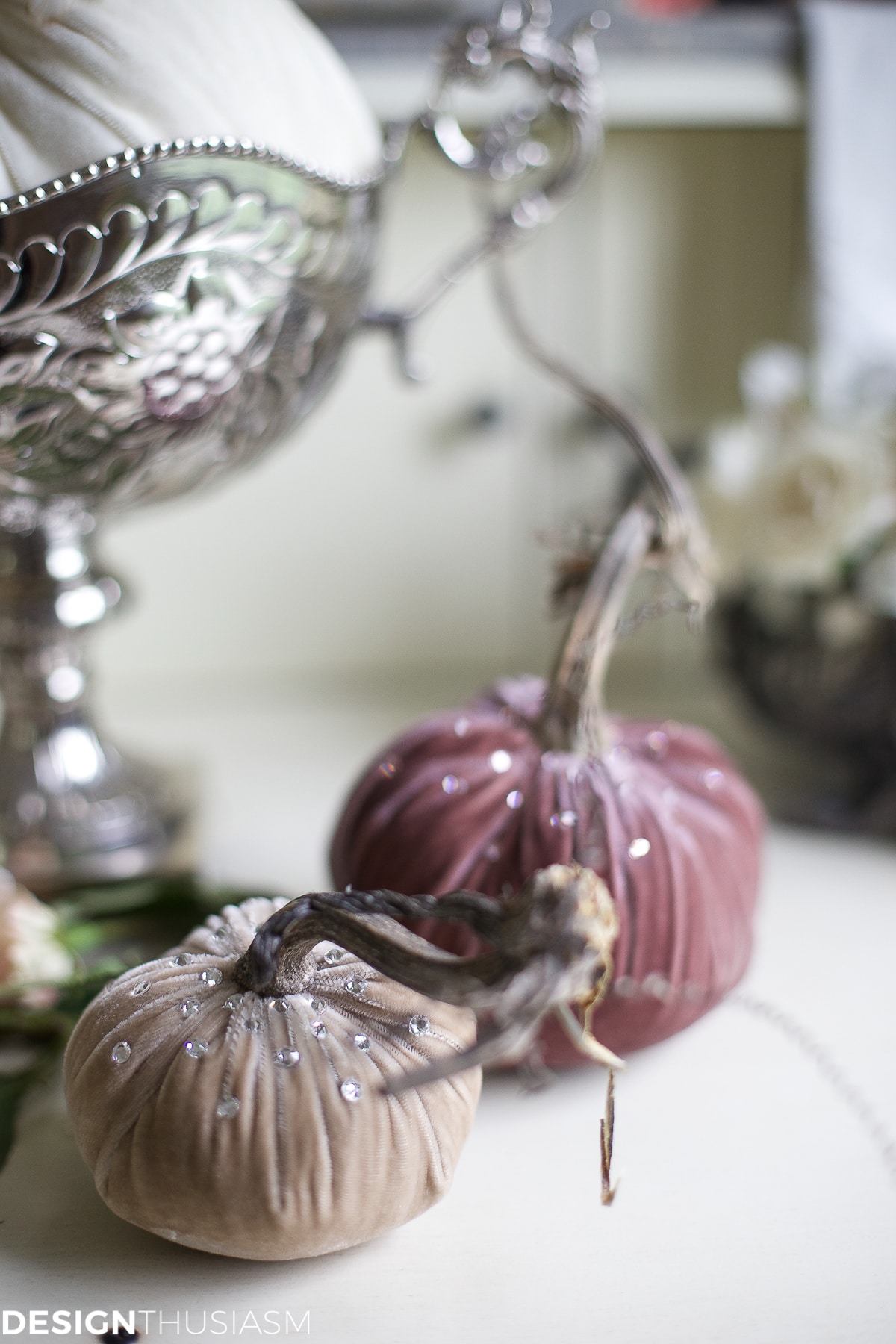 Feather pumpkins styled in hutch