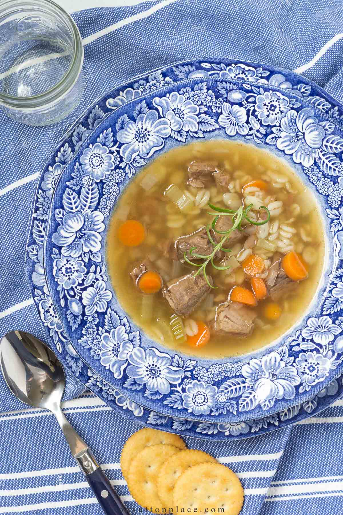 vegetable barley soup recipe in bowl with crackers