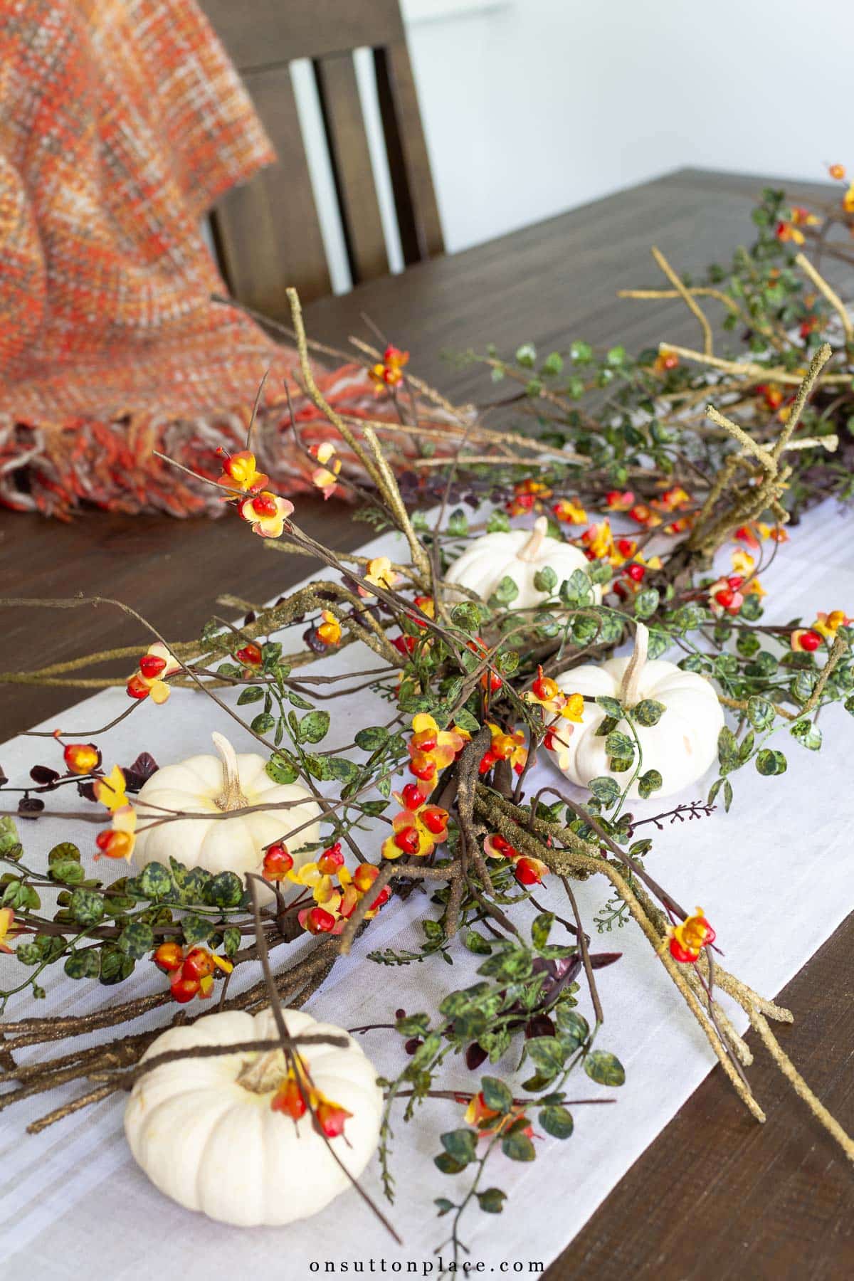 faux bittersweet garland on dining table
