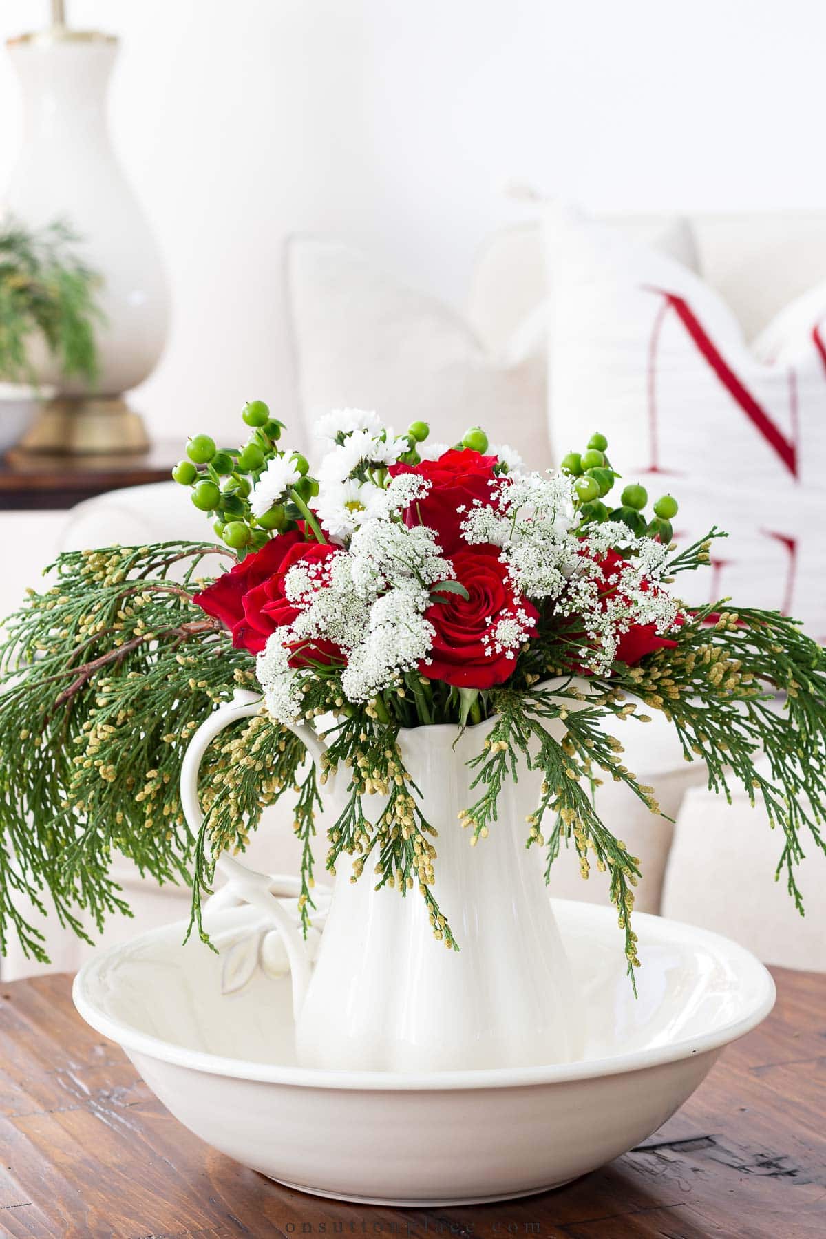 timeless christmas decor red and white flowers on coffee table