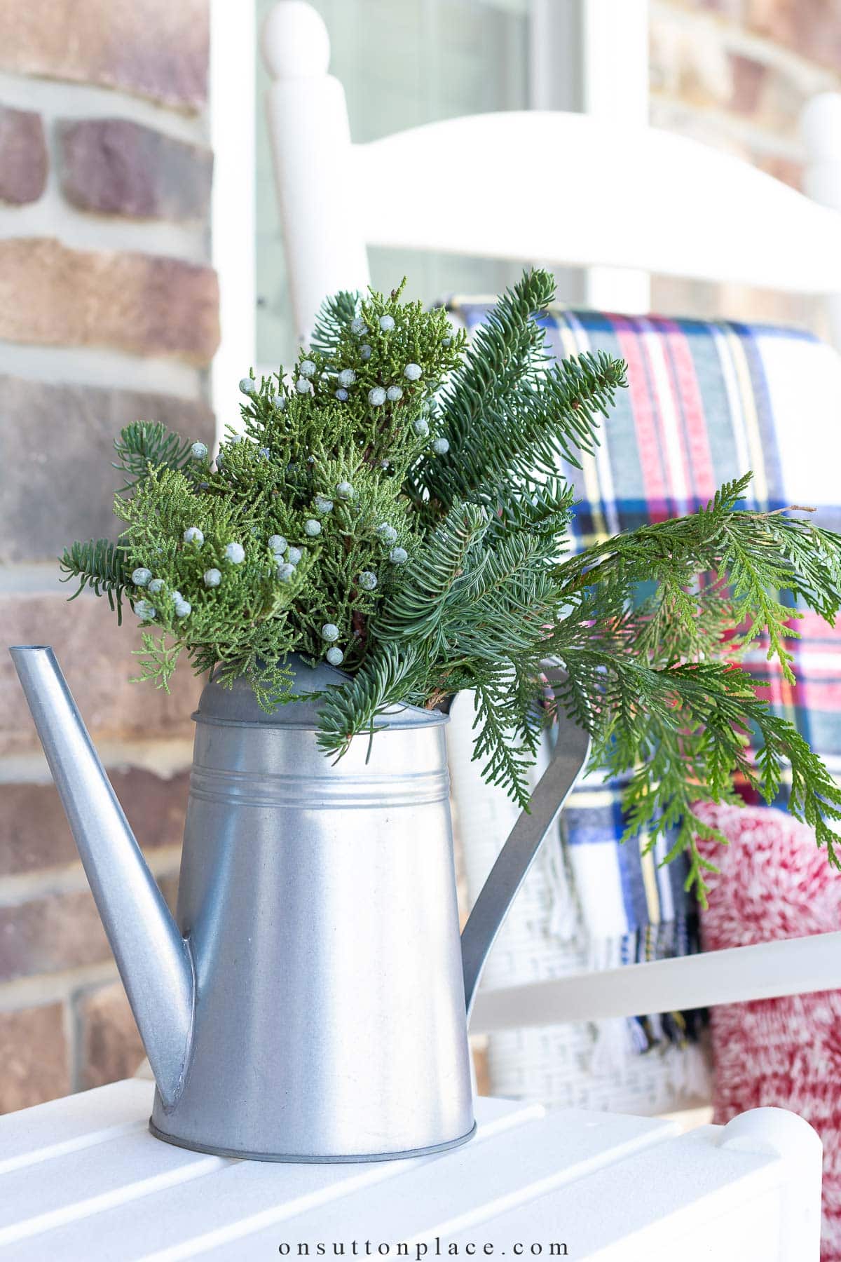 christmas porch decor ideas fresh greens in watering can