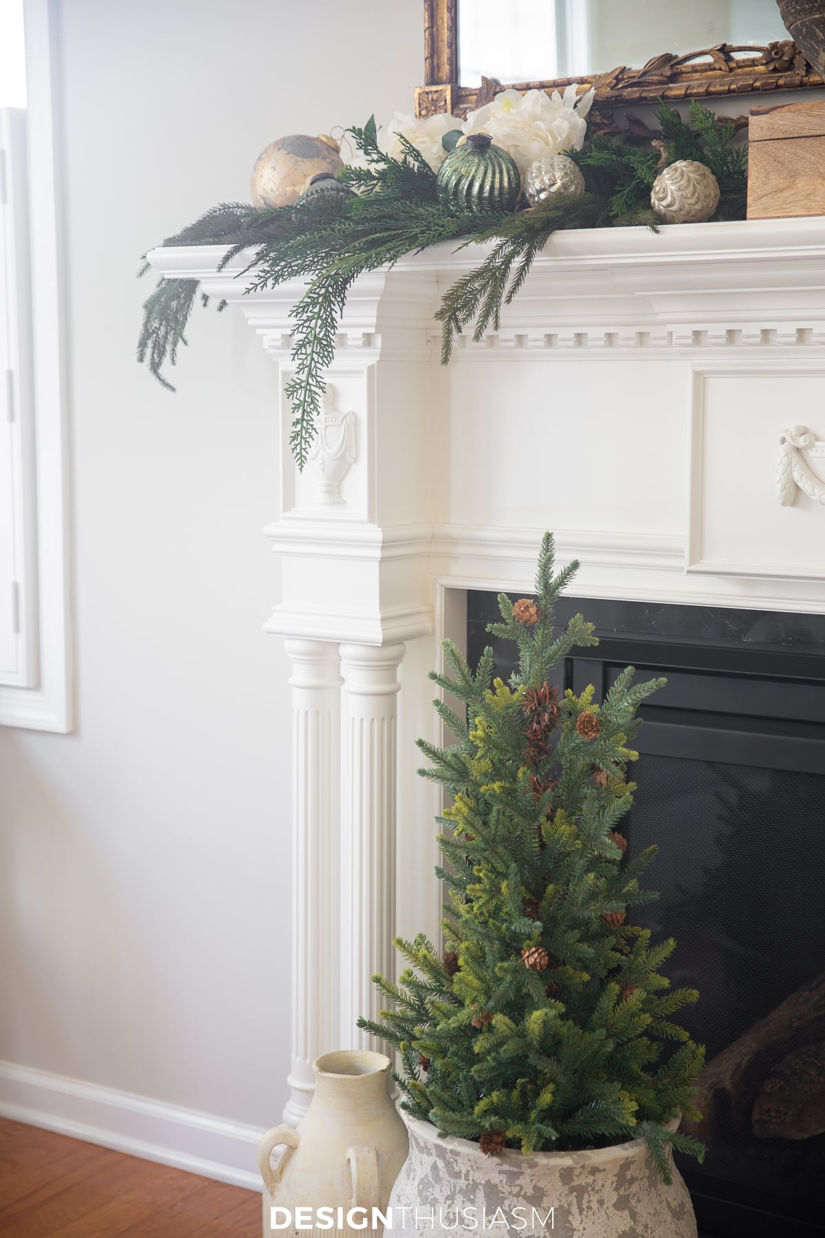 mini tree next to romantic holiday mantel