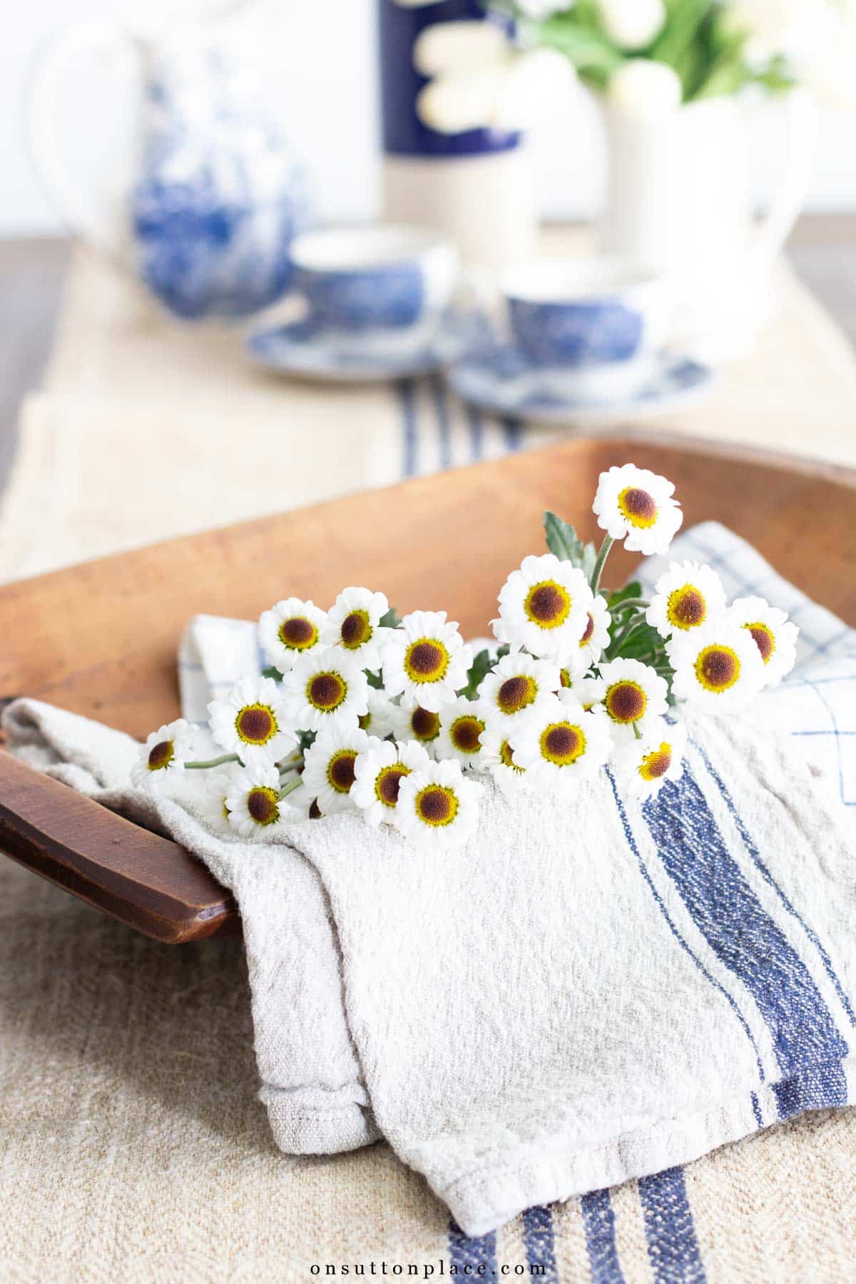 wood dough bowl with grain sack and flowers