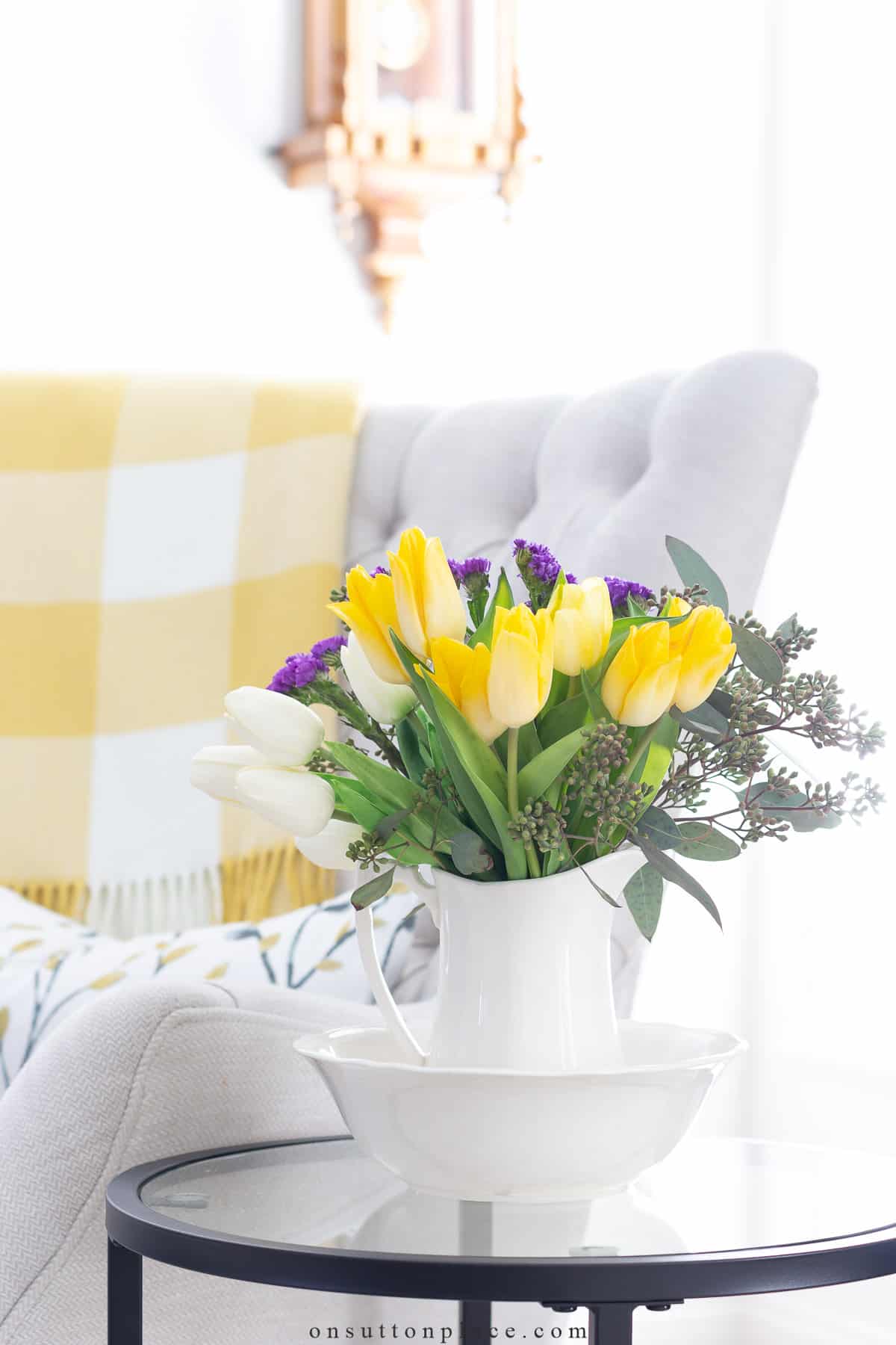 refreshing spring decor idea yellow tulips in small pitcher