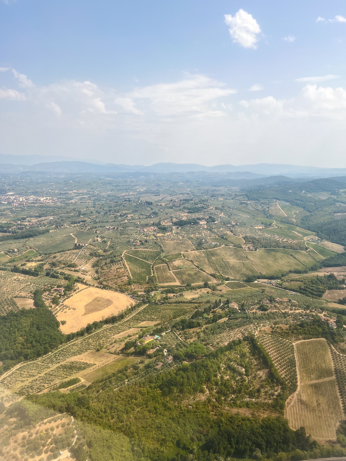 view of Tuscan countryside from the plane